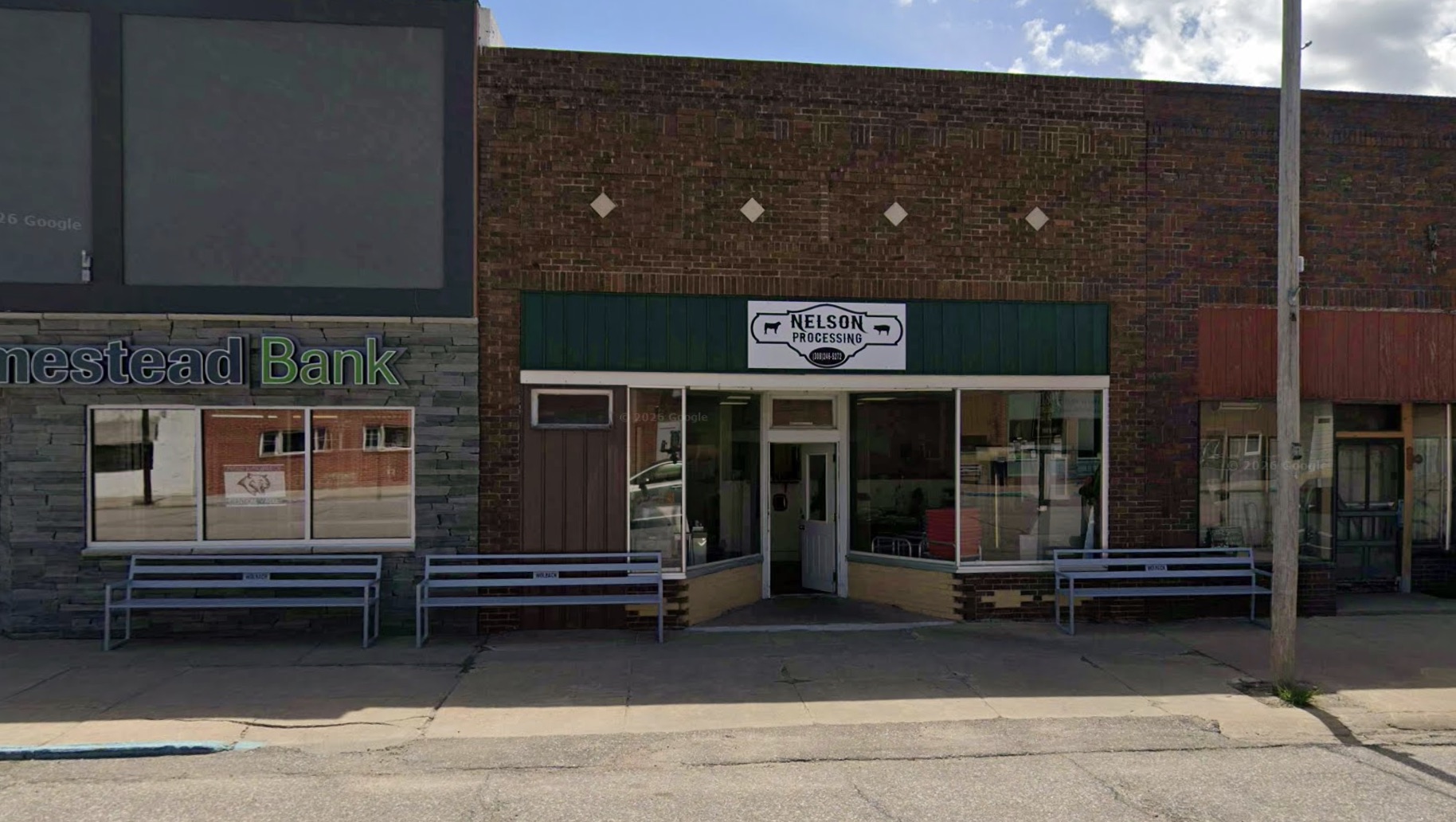 The Nelson Processing storefront on Center Avenue in Wolbach