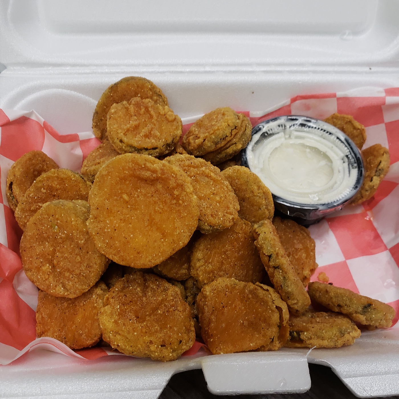 Golden fried pickles with dipping sauce from The Choo-Choo