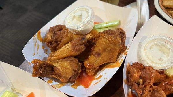 A basket of Choo-Choo wings with celery and ranch