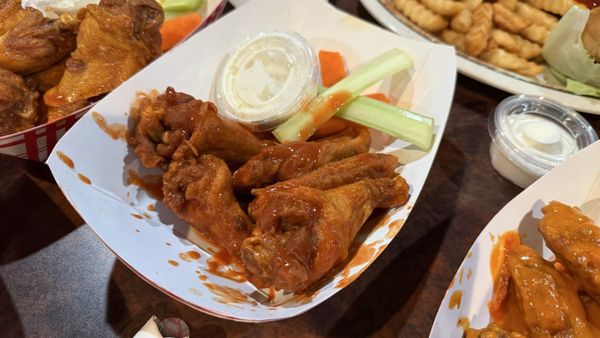 Sauced wings with celery and ranch at The Choo-Choo